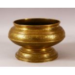 A GOOD ISLAMIC ENGRAVED AND CHASED PEDESTAL BRASS BOWL, profusely decorated with bands of foliate