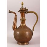 AN ISLAMIC BRONZE EWER, with hinged lid and engraved decoration, 36cm high.