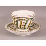 AN 18TH CENTURY TURKISH KUTAHYA POTTERY CUP & SAUCER - decorated with yellow and green floral