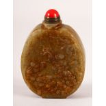 A CHINESE CARVED JADE SNUFF BOTTLE - carved with boys and funghi the verso with calligraphy, 8cm