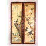 A LARGE PAIR OF HARDWOOD FRAMED CHINESE SCROLL PAINTINGS, each depicting scenes of birds amongst