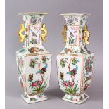 A PAIR OF 19TH CENTURY CHINESE CANTON FAMILLE ROSE PORCELAIN VASES, with a white ground decorated
