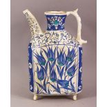 A TURKISH IZNIK POTTERY WATER VESSEL - decorated in blue & white depicting flora, 20cm