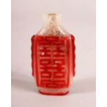 A CHINESE OVERLAY FROSTED GLASS SNUFF BOTTLE - overlaid in red with calligraphy, 6.5cm