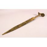 AN ARCHAIC STYLE BRONZE SHORT SWORD, with twisted handle and unusual pommel, 49.5cm long.
