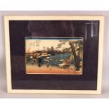 A JAPANESE FRAMED WOOD BLOCK PRINT - depicting figures in village life, 58cm x 48cm