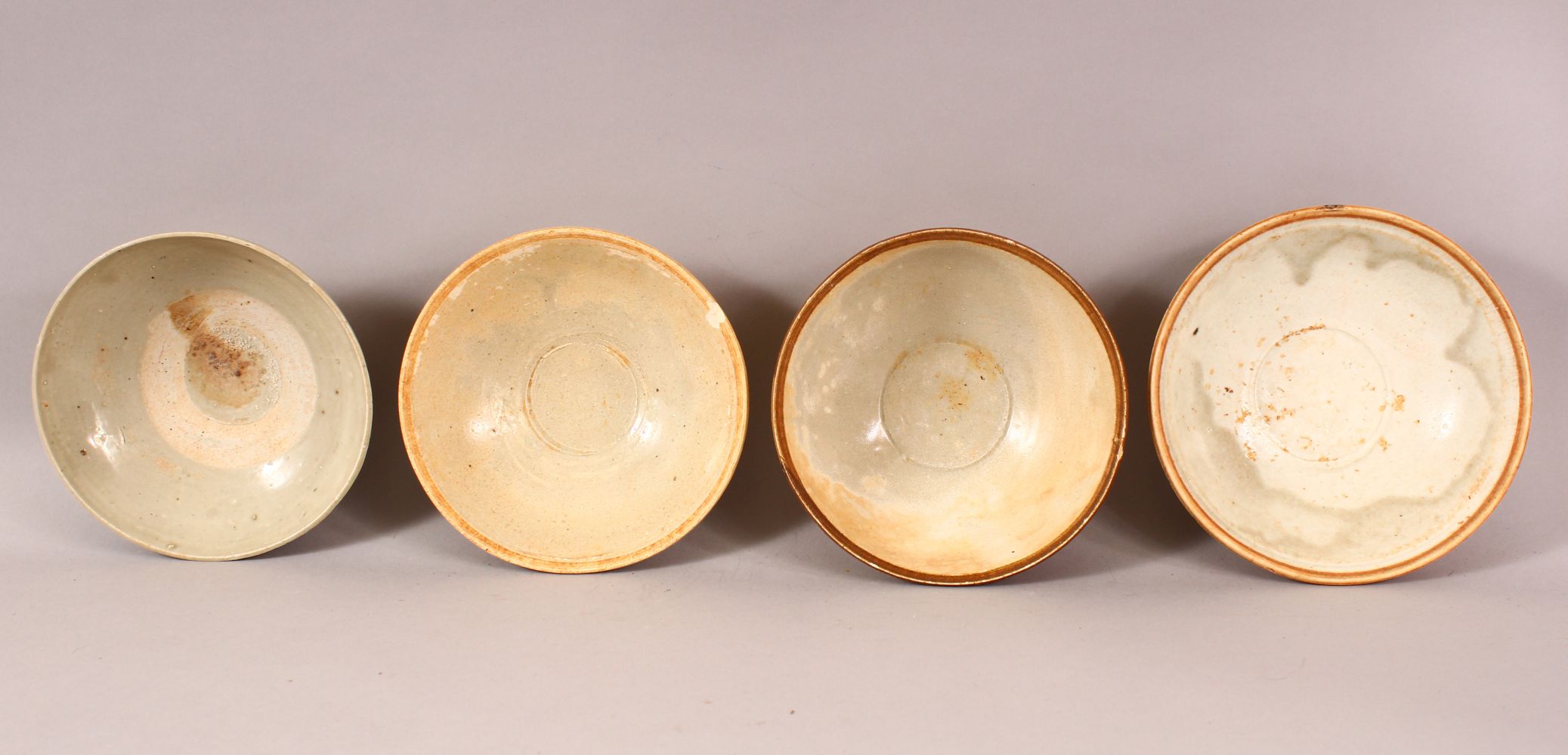 A MIXED LOT OF 4 EARLY CHINESE POTTERY BOWLS - Varying glaze types & sizes -largest from 16cm