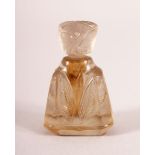 A VERY SMALL INDIAN CARVED ROCK CRYSTAL PERFUME BOTTLE AND STOPPER, 4cm high.