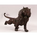 A JAPANESE MEIJI BRONZE FIGURE OF A LION, the lion in predatory stance with growling face, 56cm