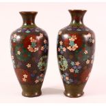 A PAIR OF 19TH CENTURY CHINESE CLOISONNE VASES - with floral panel decoration upon a dark ground