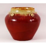 A CHINESE FLAMBE PORCELAIN JAR / VASE - with a graduating flambe glaze with raised stud boss