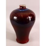 A CHINESE RED AND PURPLE FLAMBE GLAZED VASE, 33cm high.