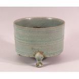 A CHINESE CELADON TRIPOD PORCELAIN CENSER - the body with a celadon glaze and three feet, 13cm