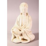 A CHINESE BLANC DE CHINE PORCELAIN FIGURE OF GUANYIN, in a seated pose, the verso with a seal