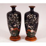 A FINE PAIR OF JAPANESE MEIJI PERIOD CLOISONNE VASES AND STANDS, decorated with birds amongst native