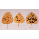 THREE ISLAMIC LEAFS WITH CALLIGRAPHY - each leaf with some ink calligraphy work (3)