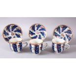 A SET OF 3 19TH CENTURY CHINESE FAMILLE ROSE CUP & SAUCERS, with bands of floral decoration, cups