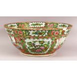 A LARGE 19TH CENTURY CHINESE CANTON FAMILLE ROSE PORCELAIN BOWL - with panel decoration of