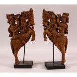 A PAIR OF 19TH CENTURY SOUTH INDIAN CARVINGS OF HORSE RIDERS, both elevated on wooden stands, both