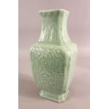 A CHINESE SQUARE FORM CELADON VASE with relief decoration, six character mark to the base, 32.5cm