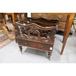 A REGENCY ROSEWOOD CANTERBUTY with shaped three division top single drawer on turned legs with