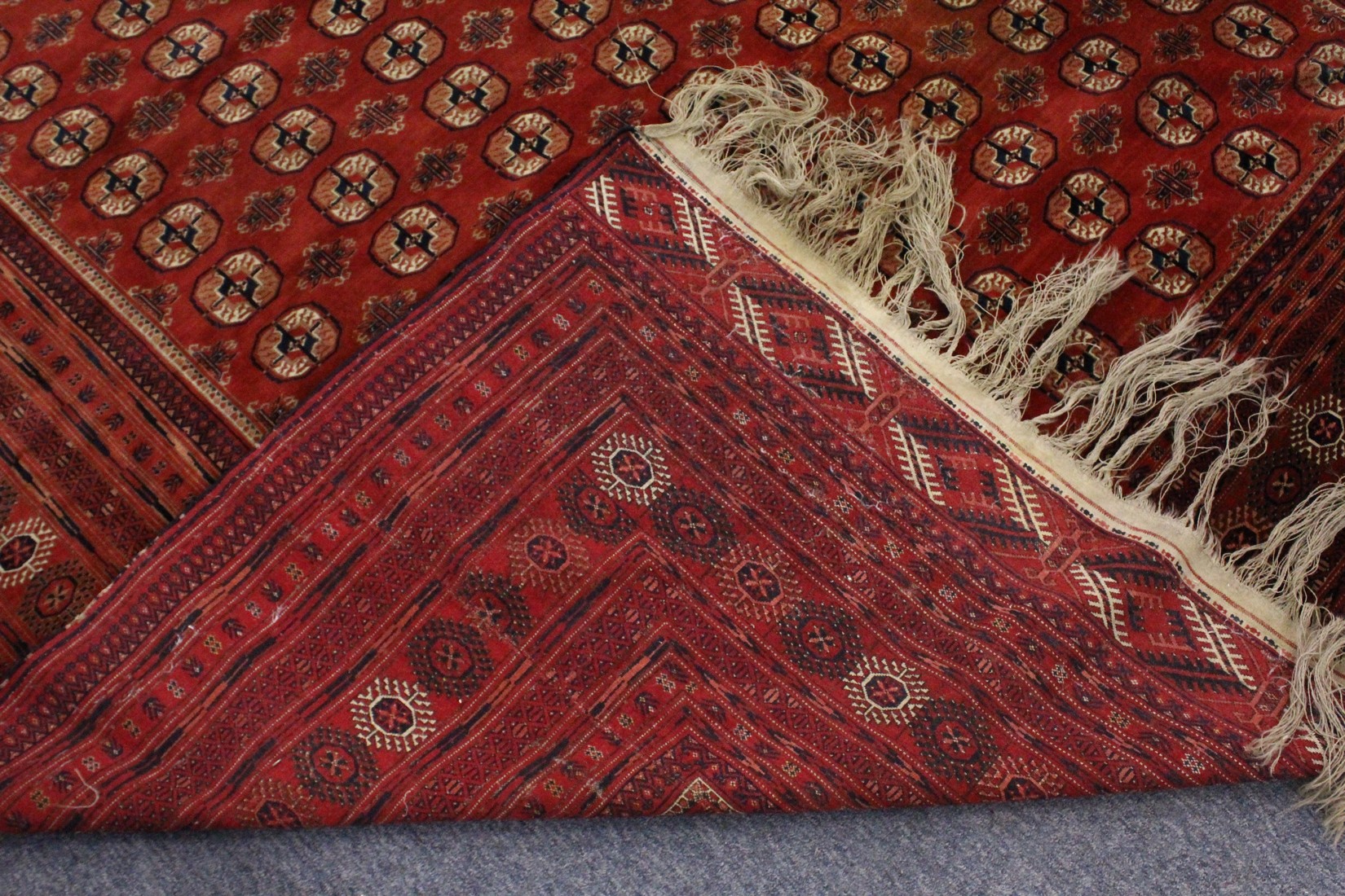 A LARGE BOKHARA CARPET, mid-20th century, red ground with seven rows of TWENTY-ONE GULLS, within a - Image 7 of 8