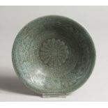 A CHINESE GREEN CRACKLE GLASS DISH with caligraphy.