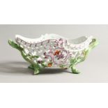 A CONTINENTAL PORCELAIN PIERCED DESSERT SET painted with flowers comprising circular dishes, 9ins