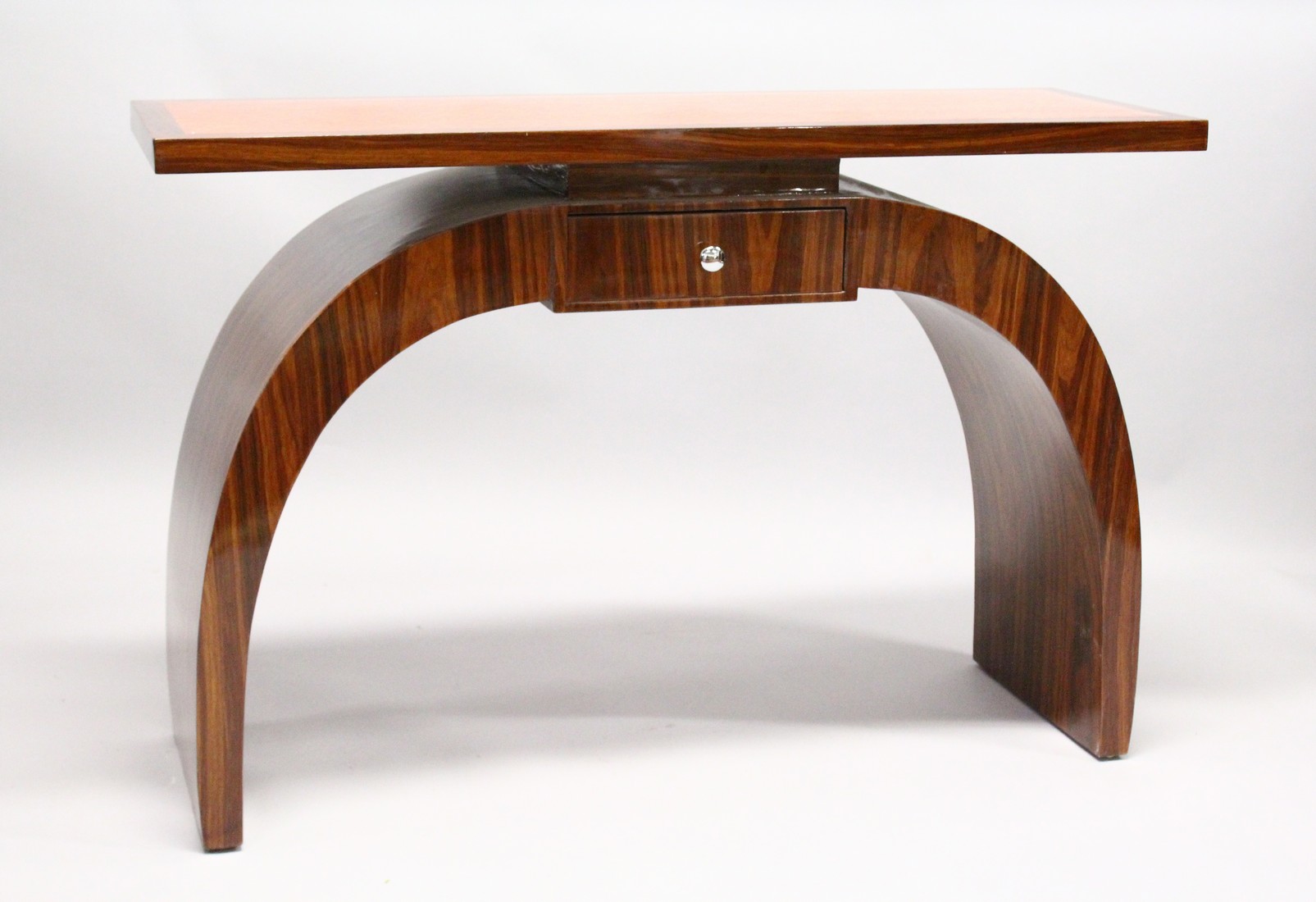 AN ART DECO STYLE ROSEWOOD CONSOLE TABLE, with a inlaid top, small drawer on curving supports 4ft