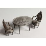 A GOOD SILVER TABLE AND PAIR OF CHAIRS