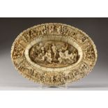 A SUPERB 18TH CENTURY EUROPEAN CARVED IVORY CIRCULAR DISH, the centre carved with nudes and