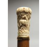 A 19TH CENTURY EUROPEAN WALKING CANE with carved ivory handle, deer in a landscape by BRIGG, LONDON.
