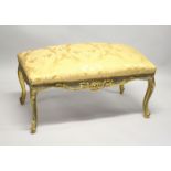 A GILT FRAMED STOOL UPHOLSTERED IN GOLD DAMASK. 3ft 2ins long x 1ft 8ins wide x 1ft 8ins high.