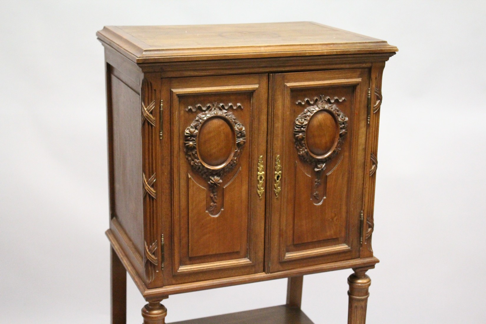 A LATE 19TH CENTURY FRENCH WALNUT MUSIC CABINET, with a pair of carved panelled doors enclosing - Image 2 of 7