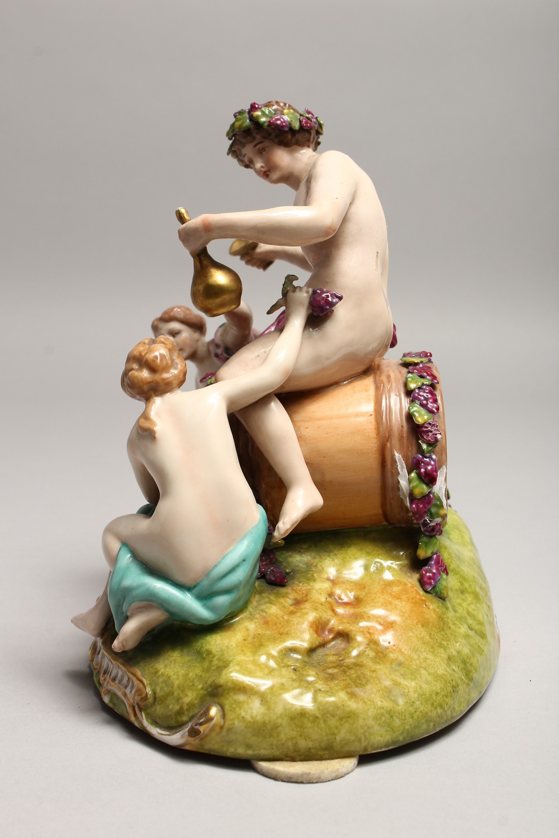 A GOOD 19TH CENTURY CONTINENTAL POTTERY GROUP depicting the grape harvest, one sitting on a - Image 2 of 7