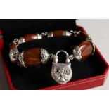 A SILVER 'SCOTTISH' AGATE SET TOGGLE BRACELET