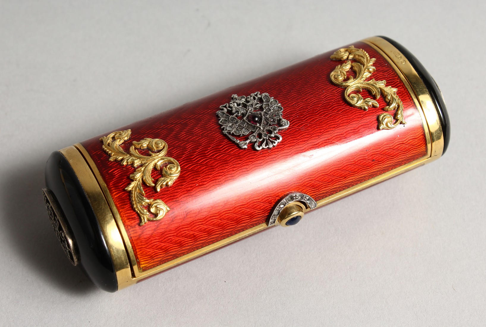 A SUPERB RUSSIAN RED ENAMEL AND SILVER DRUM SHAPED BOX AND COVER with silver scrolls and