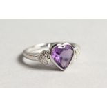 A SILVER AMETHYST AND DIAMOND RING