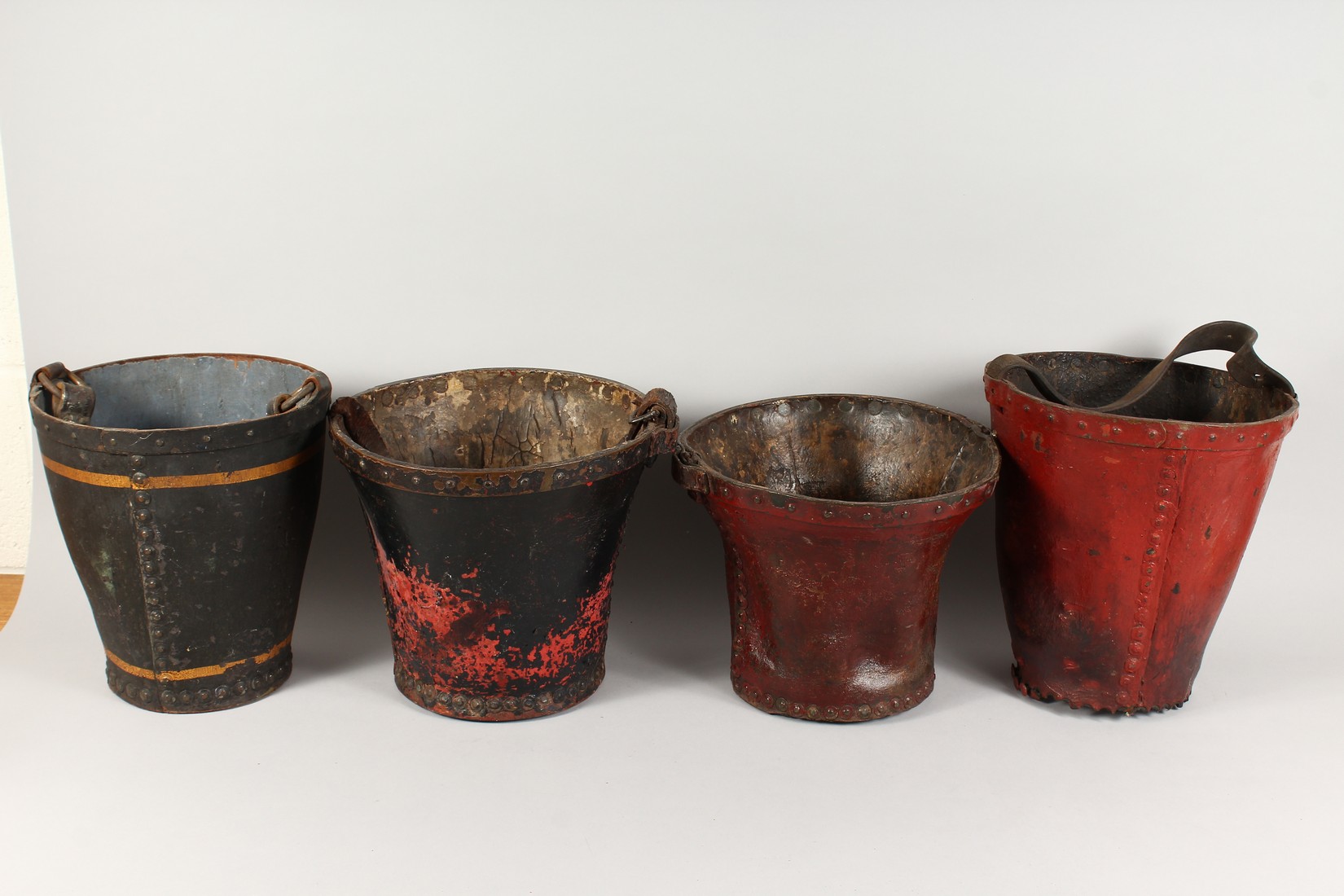 FOUR EARLY 18TH CENTURY LEATHER FIRE BUCKETS with various coat of arms. - Image 2 of 3