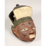 A PAINTED TRIBAL MASK 13ins long