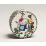 A CHINESE SILVERED CIRCULAR BOX AND COVER, famille rose top with figures. 2.25ins diameter