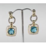 A PAIR OF SILVER AND BLUE TOPAZ EARRINGS.