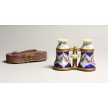 A VERY GOOD FRENCH MOTHER OF PEARL AND BLUE ENAMEL OPERA GLASSES, with garlands of roses 4.25ins