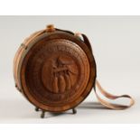 A RUSSIAN CARVED WOOD AND METAL BOUND CIRCULAR WATER FLASK 7ins diameter.