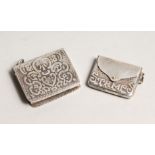 TWO NOVELTY SILVER STAMP CASES