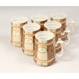 A SET OF SIX RUSSIAN PORCELAIN TANKARDS No. 1 - VI., simulating wooden tankards, 6ins high.