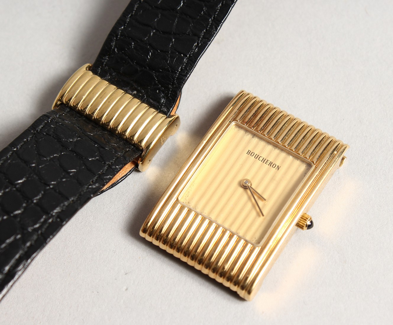 A LADIES VERY GOOD BOUCHERON 18CT GOLD WRISTWATCH with leather strap, No. A A /03136