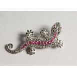 A SILVER MARCASITE AND RUBY LIZARD BROOCH.