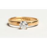 AN 18CT GOLD SOLITAIRE DIAMOND RING