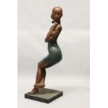 A LARGE PATINATED BRONZE OF A SEATED FEMALE FIGURE, mounted on a square base. 45ins high